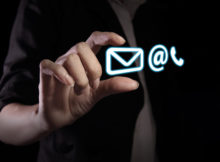 Hand showing contact icon on the virtual screen